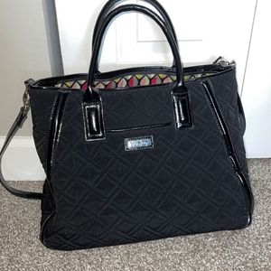 Vera Bradley black purse with shoulder strap& bottom feet